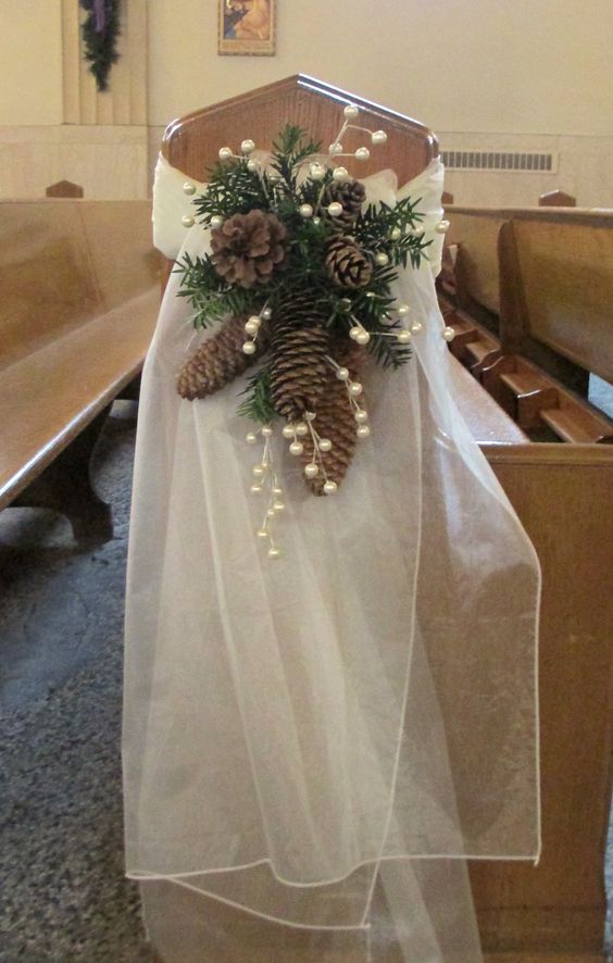 pew swag with ivory organza pine cones pine greens and berry sprigs