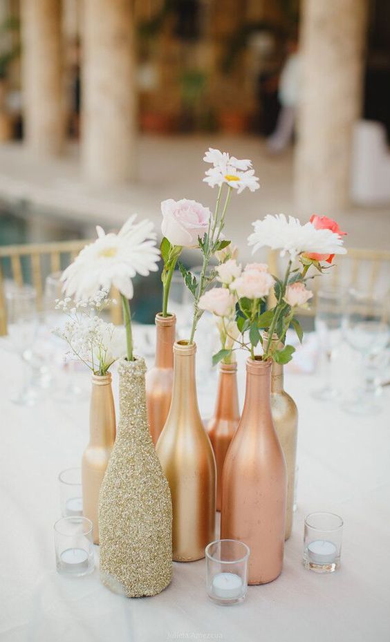 boho glitter bottles and flowers wedding centerpiece