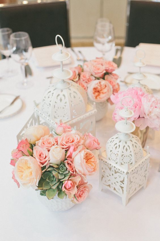 coral roses and white lantern wedding centerpiece