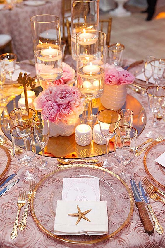 40 Fun and Easy Beach Wedding Ideas for 2024 8 pink and gold beach wedding centerpiece via sabrina lightbourn photography