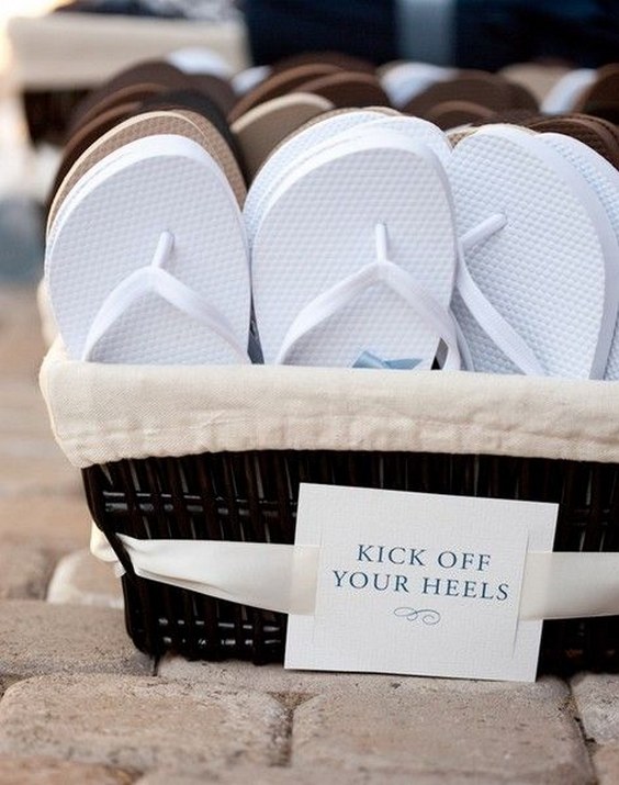 40 Fun and Easy Beach Wedding Ideas for 2024 26 place a basket of new flip flops near the dance floor