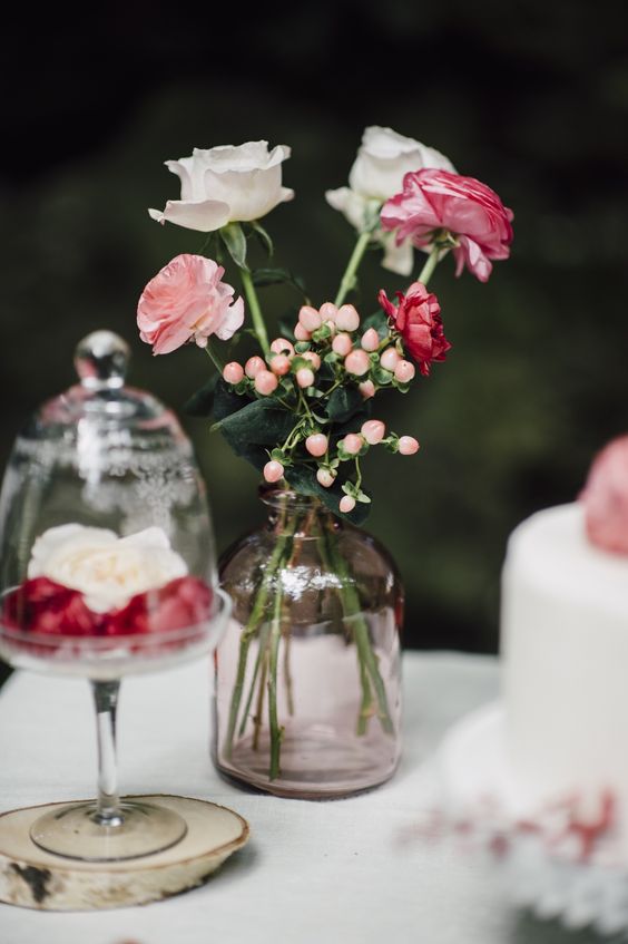 pretty pink and red rose floral wedding centerpiece