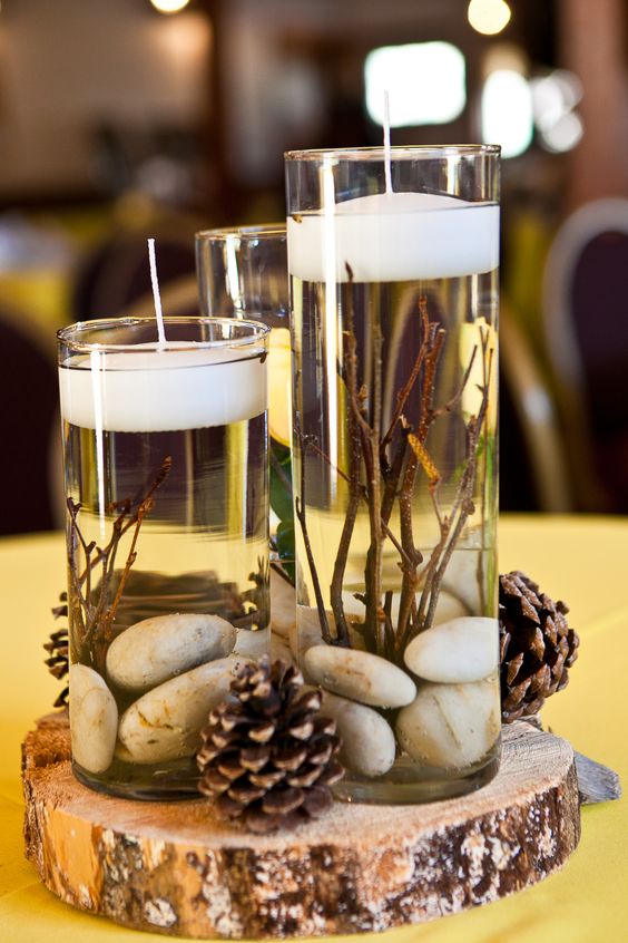 rustic winter pinecones wedding centerpiece with the candles