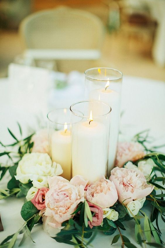 simple candle and flowers wedding centerpiece