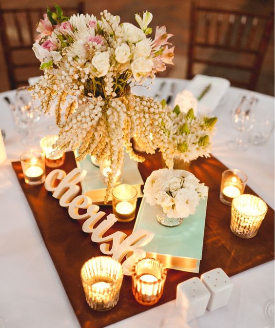 vintage books wedding centerpiece via jason tey photography