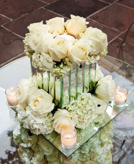 white hydrangeas and roses withe mirror wedding rreception centerpiece idea via oscar rajo