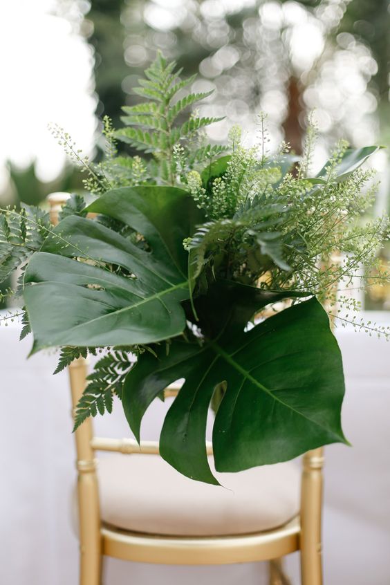 30 Tropical Leaf Greenery Wedding Decor Ideas 10 foliage chair decor via amy fanton photography