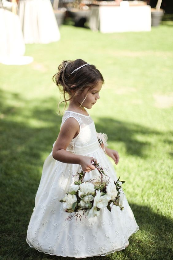 cute flower girl basket with white flowers