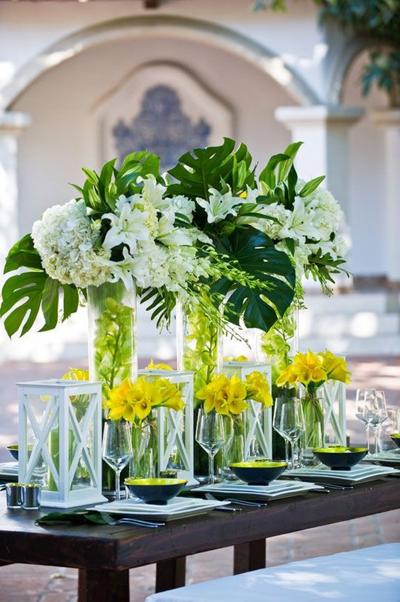 yellow and green tropical leaf wedding centerpiece via barnet photography