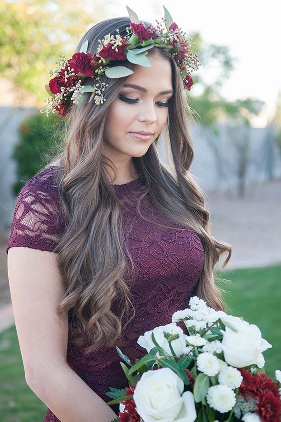 Bridesmaid wearing a burgundy lace dress and a jewel-toned floral crown made out of dahlias and seeded eucalyptus via Unfading Beauty Photography
