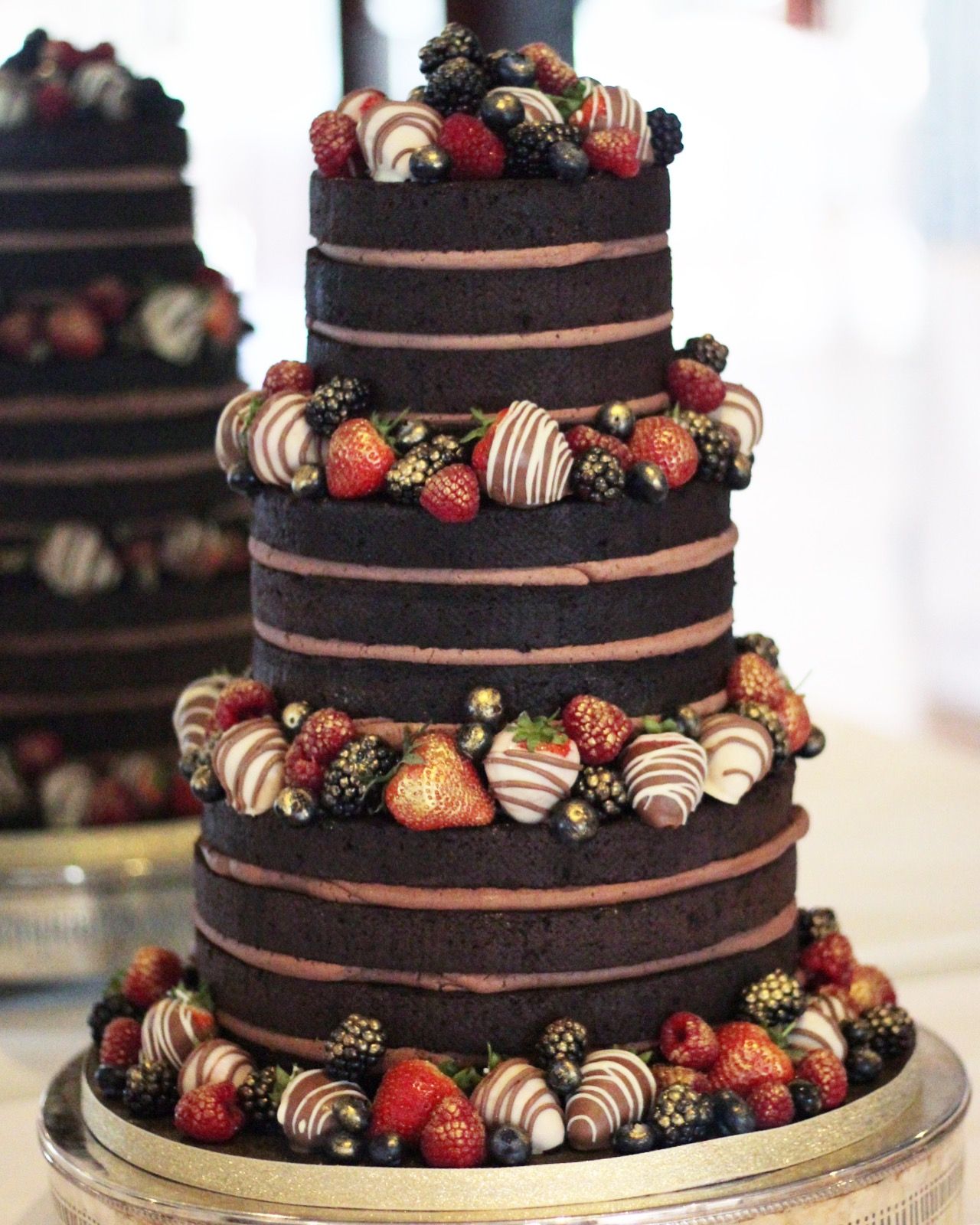 Chocolate wedding naked cake with chocolate and gold berries_ By sparkle Bakes