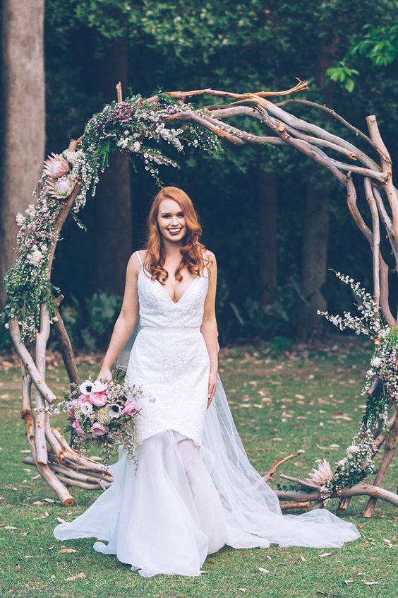 Romantic rustic ceremony arbour with pink and white flowers - Kristie Carrick Photography