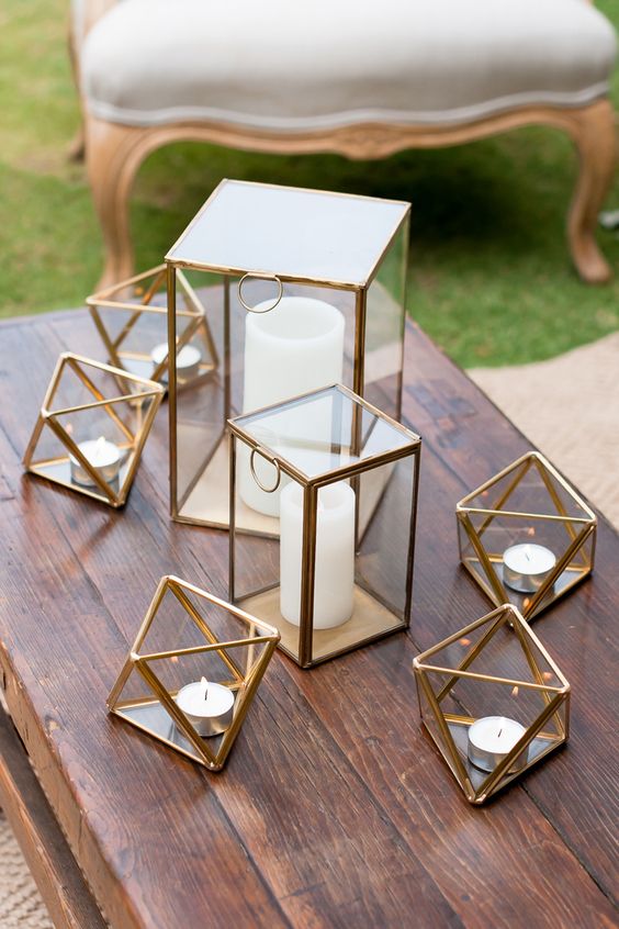 Wedding lounge centrepiece of gold geometric candleholders via Liesl Cheney Photography