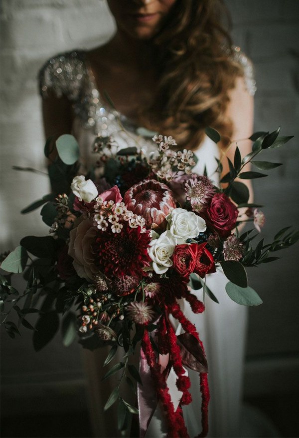deep red roses pink proteas gand greenery eucalyptus wedding bouquet ideas for winter