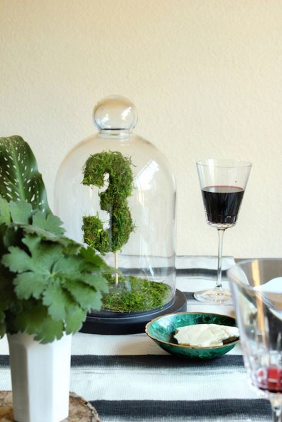 green moss sheets table numbers under bell jars