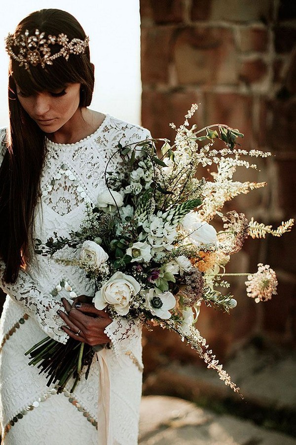 lush bouquet of wildflowers, garden roses, anemones, hellebore and bishops flower