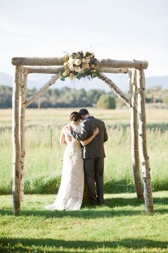 rustic log arbor with the flowers