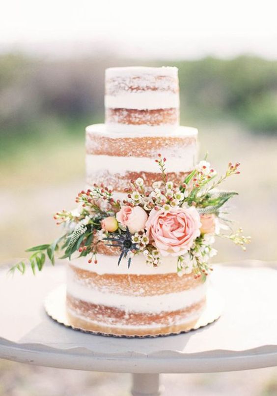 rustic naked wedding cake with flowers
