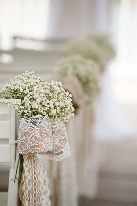 rustic wedding ceremony decor with babys breath bows