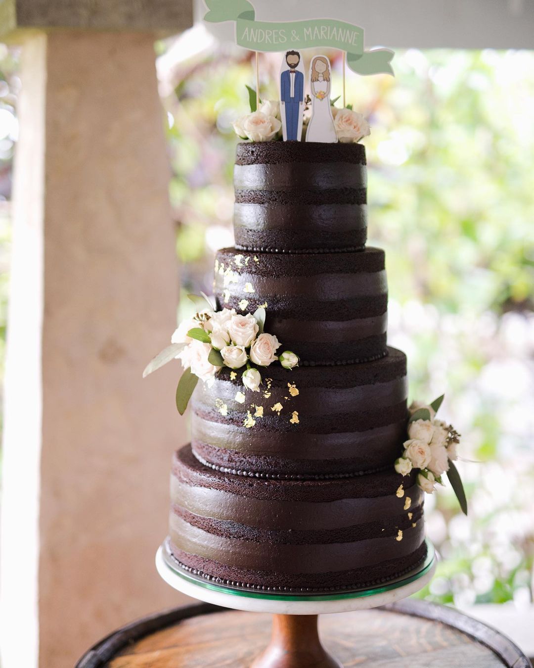 simple 4 tier semi-naked chocolate wedding cake via gabrieldiazcakedesigner