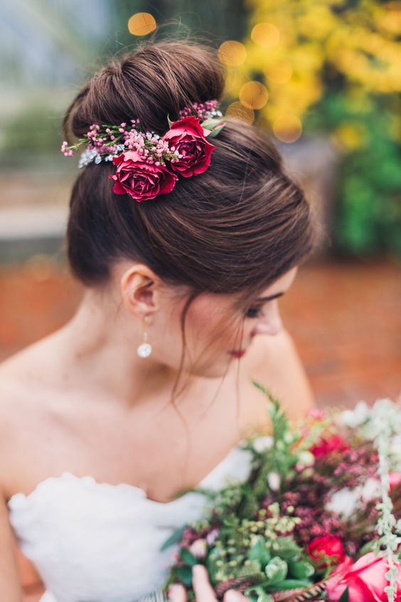 top knot wedding updo hairstyle with red roses