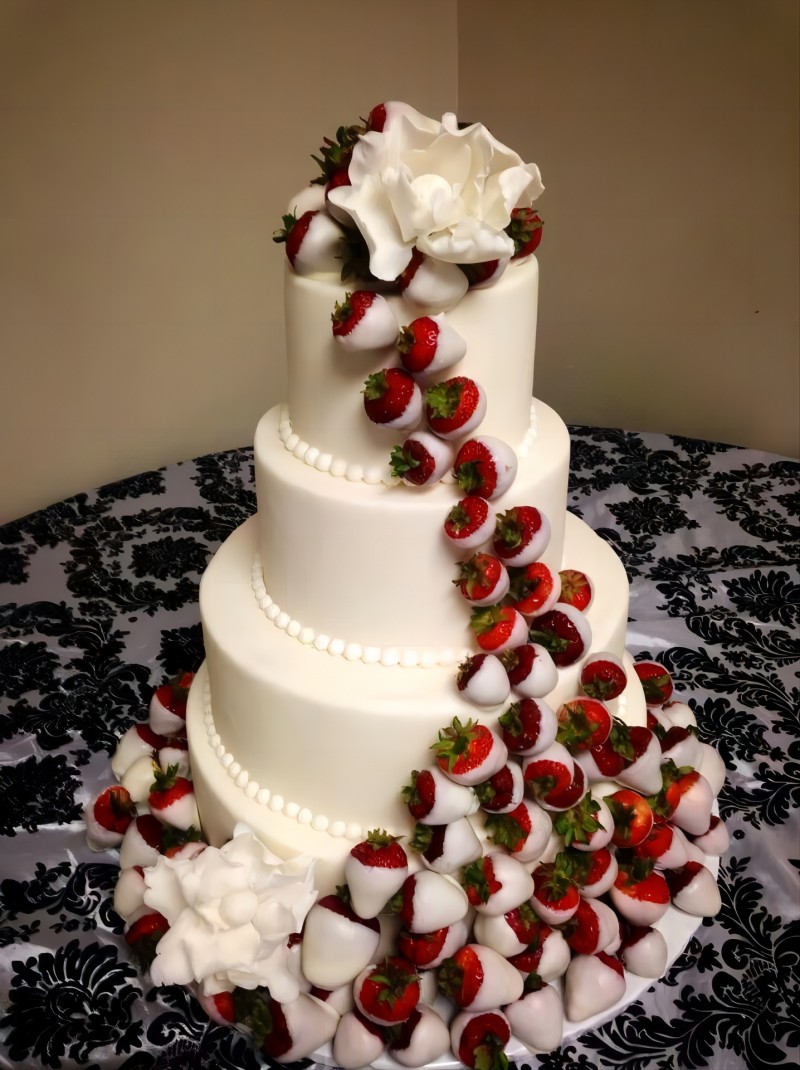 white 3 tier chocolate strawberries wedding cake