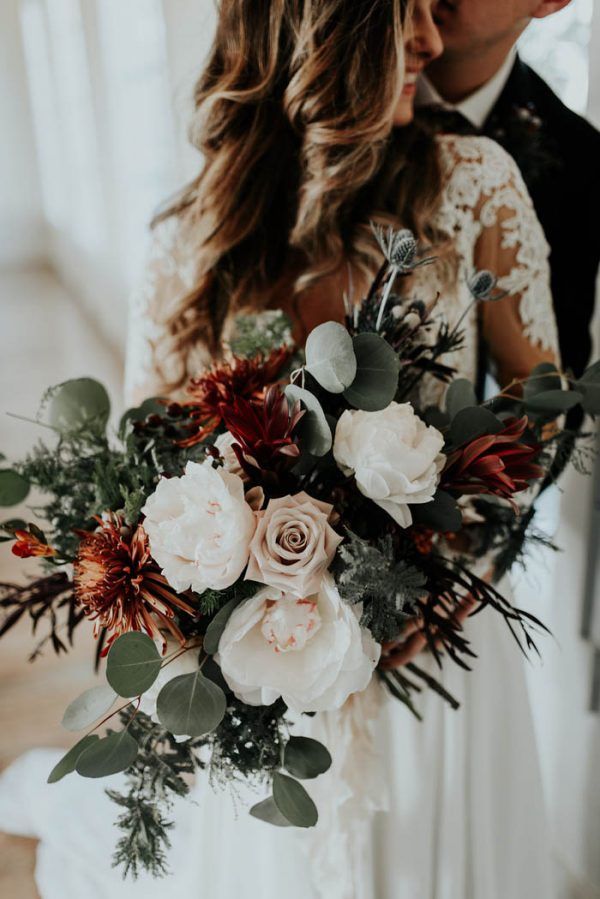 white roses and greenery eucalyptus wedding bouquet