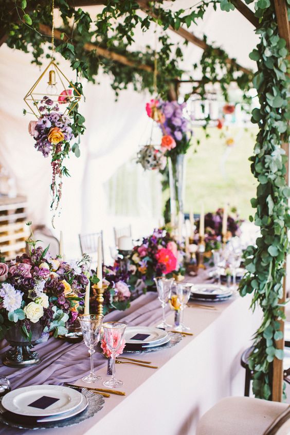 Purple wedding reception with hanging, geometric gold terrariums with flowers via Anastasia Volkova