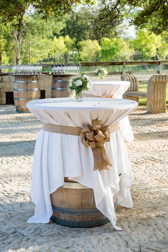 Wine barrels as high top tables for wedding reception