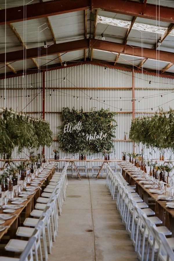 DIY barn wedding with foliage wall