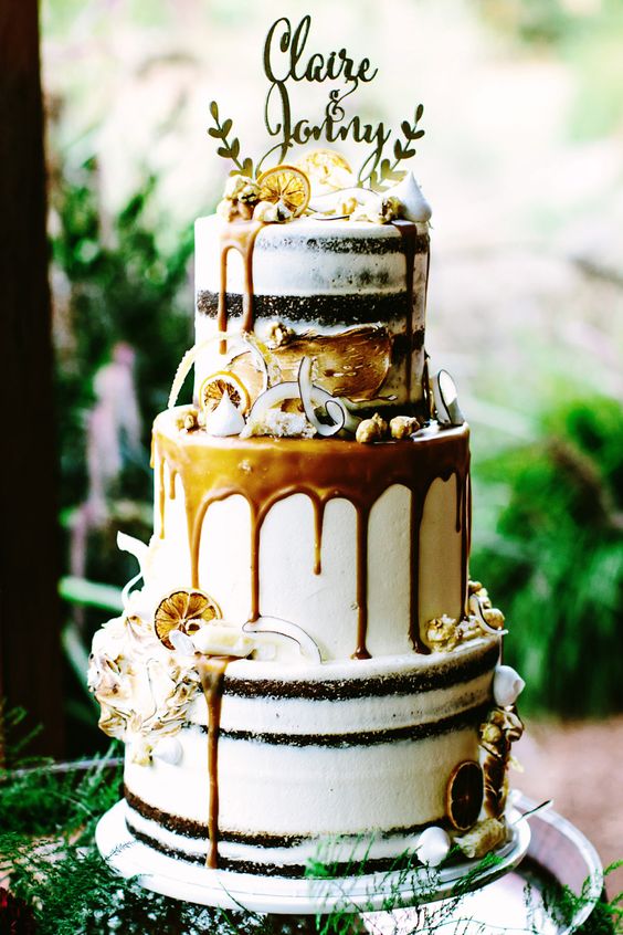 Gold boho wedding cake with caramel drip, candied lemon and shaved coconut via Bianca Kate Photography