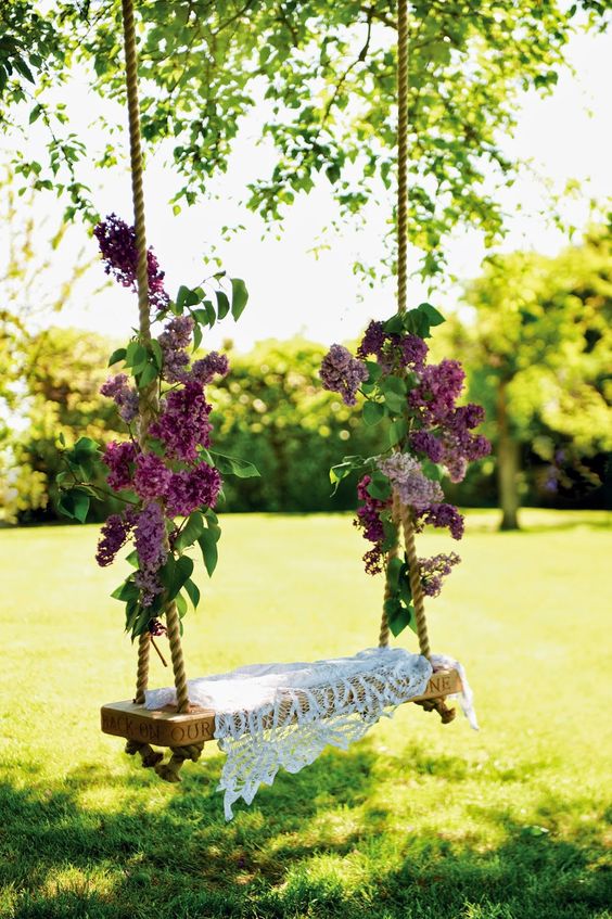 Lilac branches tied to a garden swing