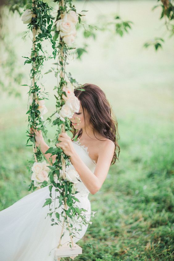 Romantic rose and jasmine covered wedding swing