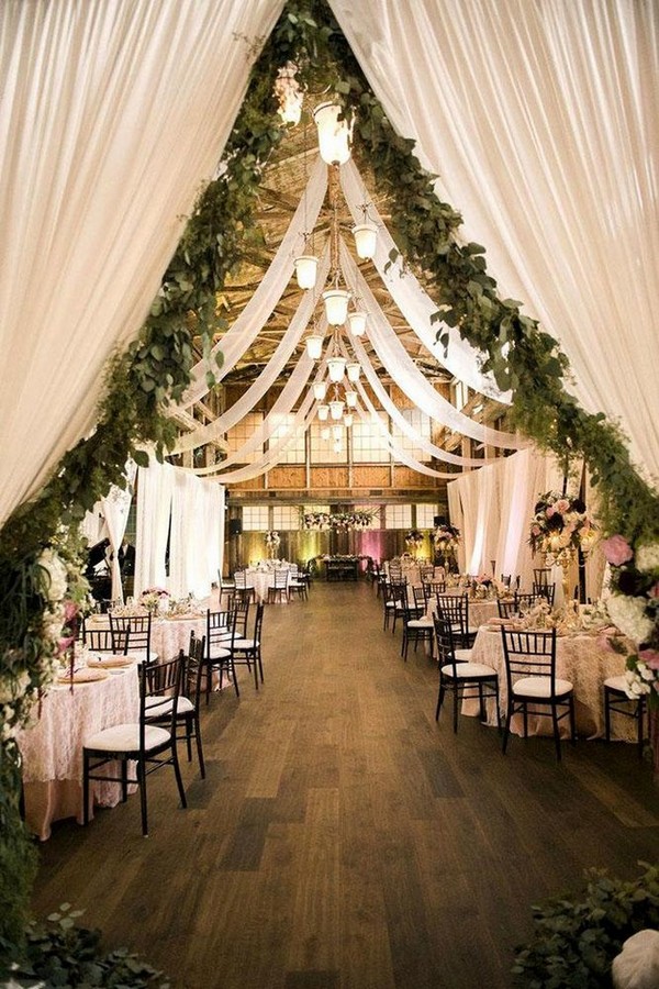 barn wedding reception with white cloth and greenery kimberly kay photography