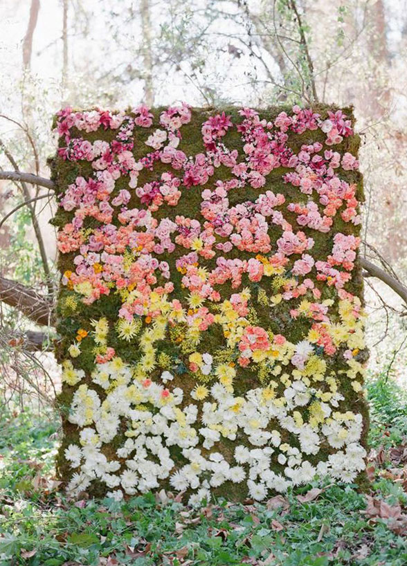 moss backdrop covered in fresh blooms