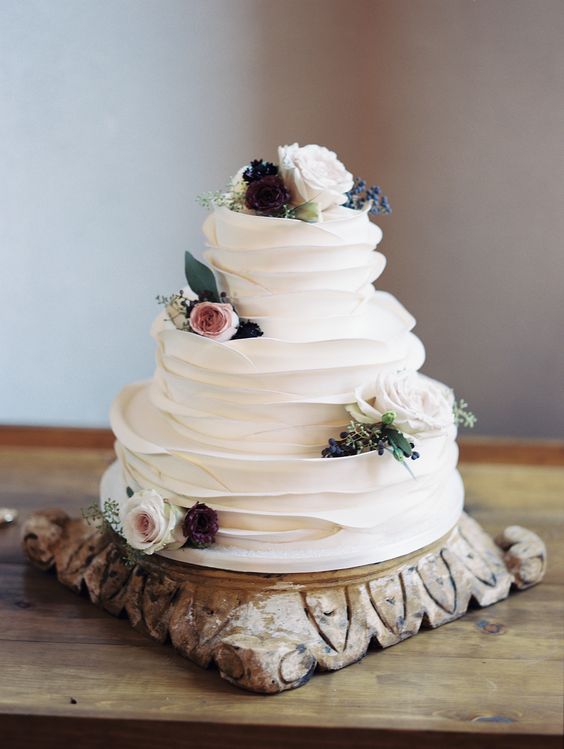 simple white white ruffled wedding cake via Charity Maurer