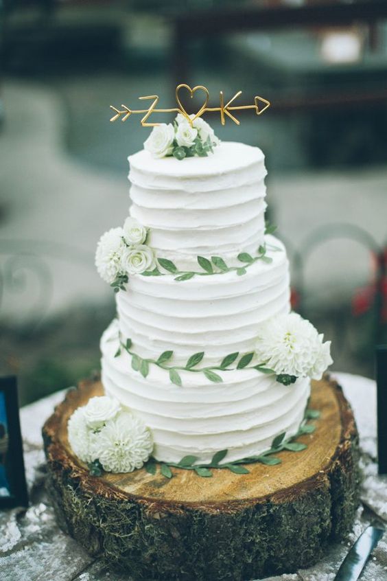 sweetest tree-trunk wedding cake with adorable golden topper via From The Daisies