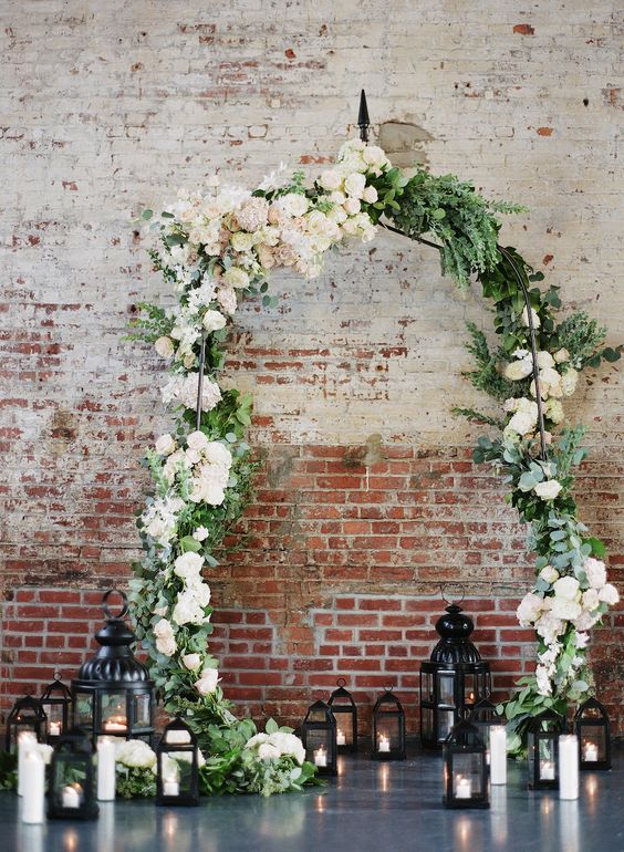 industrial greenery and lantern wedding arch