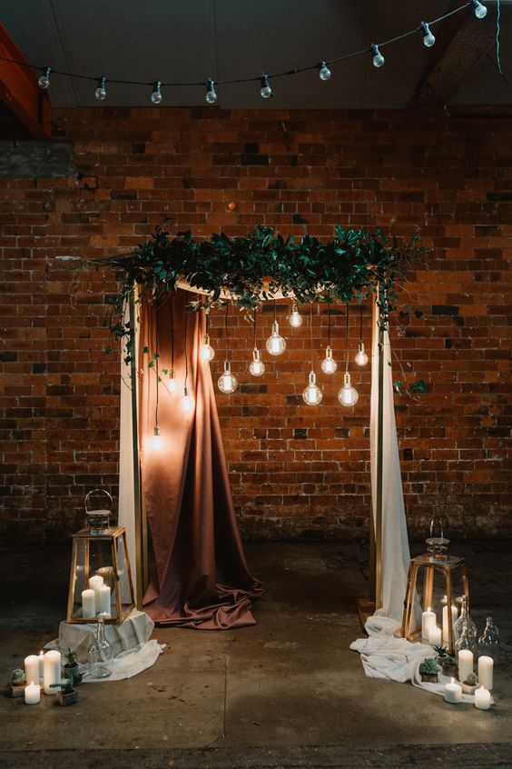 modern industrial greenery wedding arch