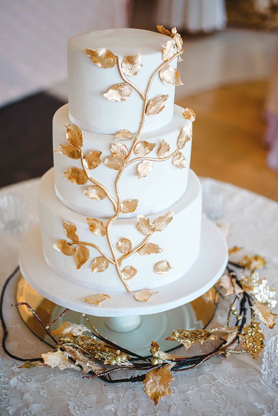 wedding cake was a vanilla and cream confection with fondant and edible gold leaves