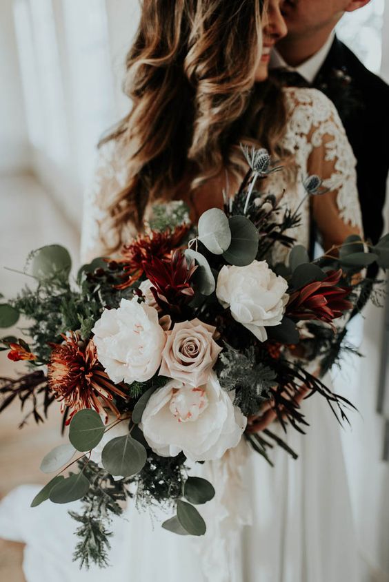 Blush, ivory, and green winter wedding bouquet