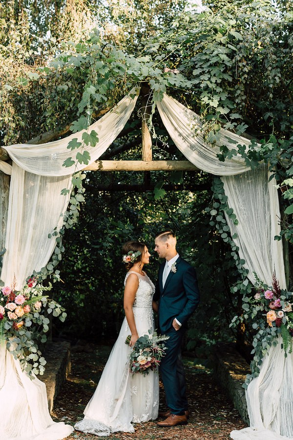 Burgundy and greenery fall wedding arch