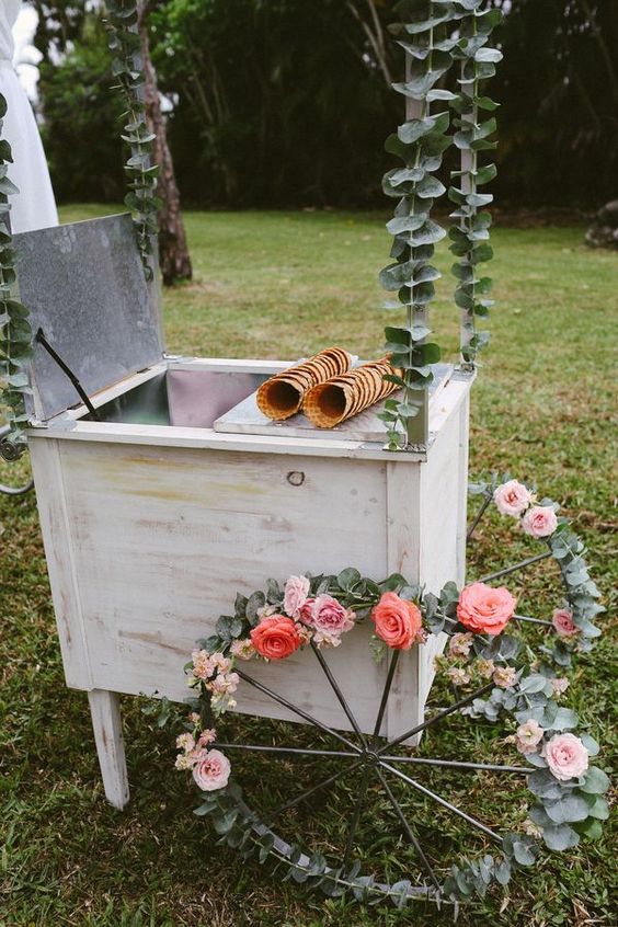 Top 14 Awesome Tips For An Outdoor Wedding 3 Vintage ice cream cart with flowered wheels via Photo by BlueSpark Photography