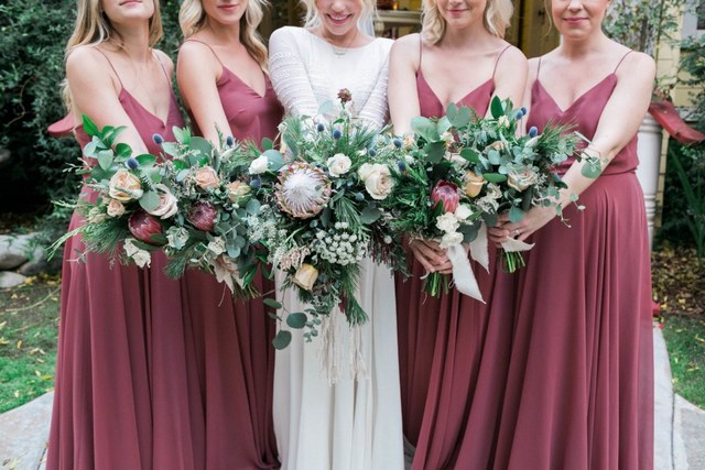 dusty rose boho bridesmaid dresses and wedding bouquet