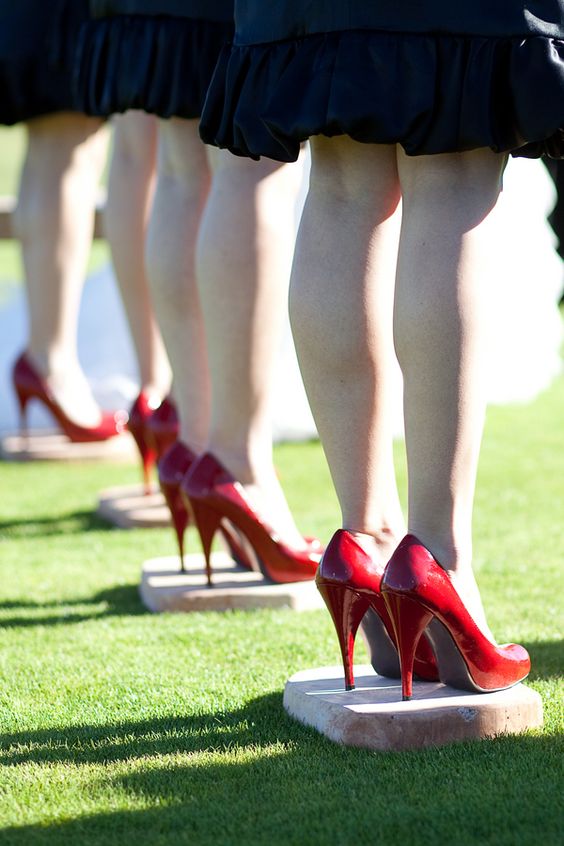 give your bridesmaids cement blocks to stand on