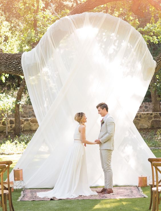 Draped wedding backdrop