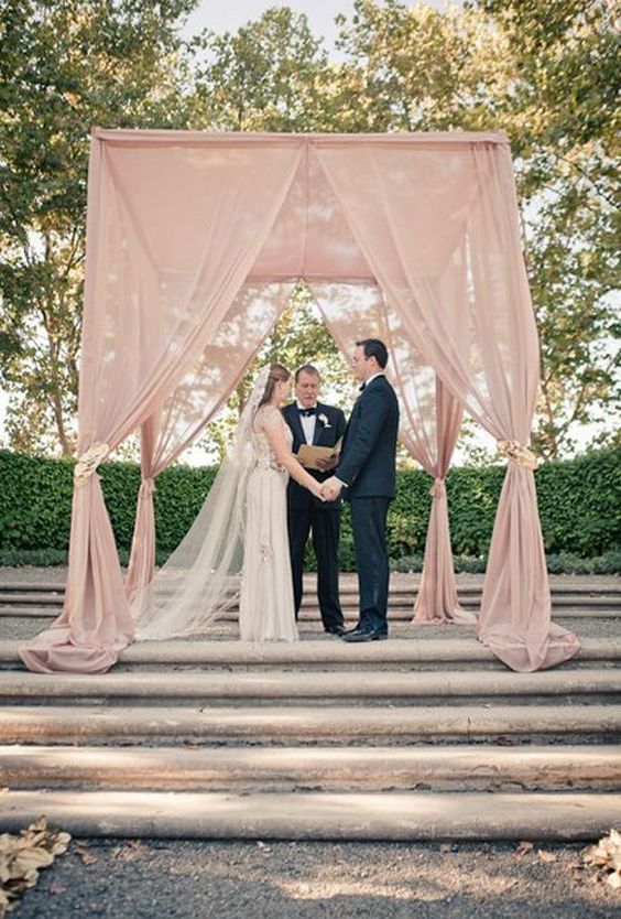 Dusty rose wedding arch