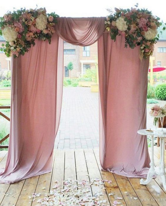 Dusty rose wedding arch