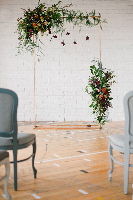 simple copper and greenery wedding backdrop