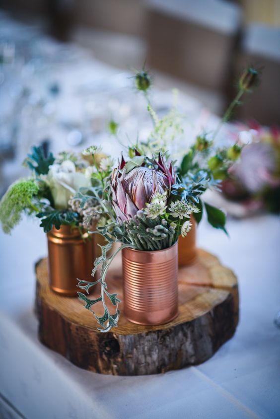 greenery and pink protea tin can wedding centerpiece